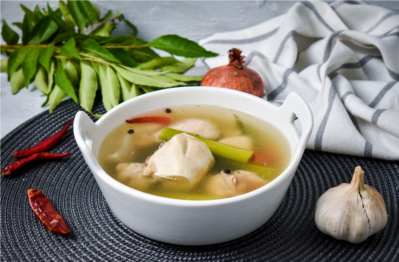Traditional serving of Garudhiya with rice and condiments